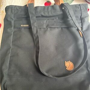 Black and tan Fjällräven Kanken tote bag